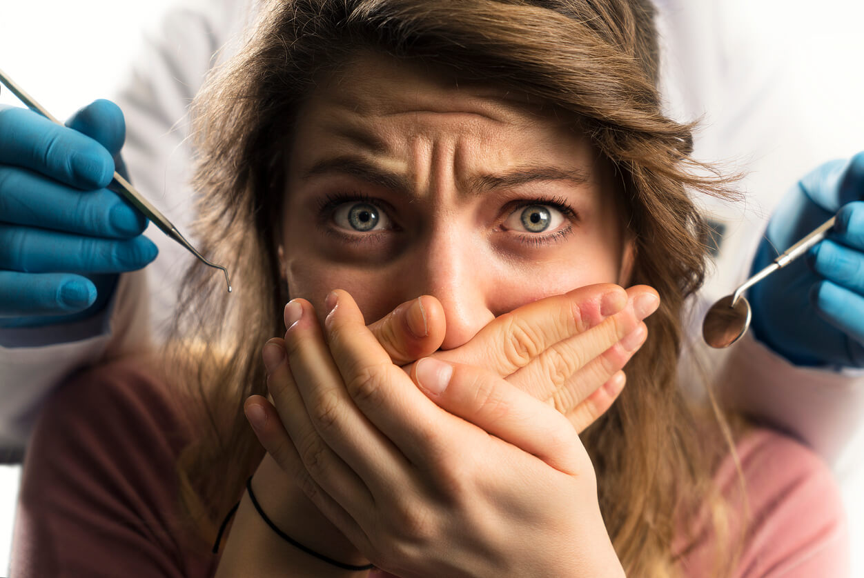 Stock image showing a scared Patient and Dentist