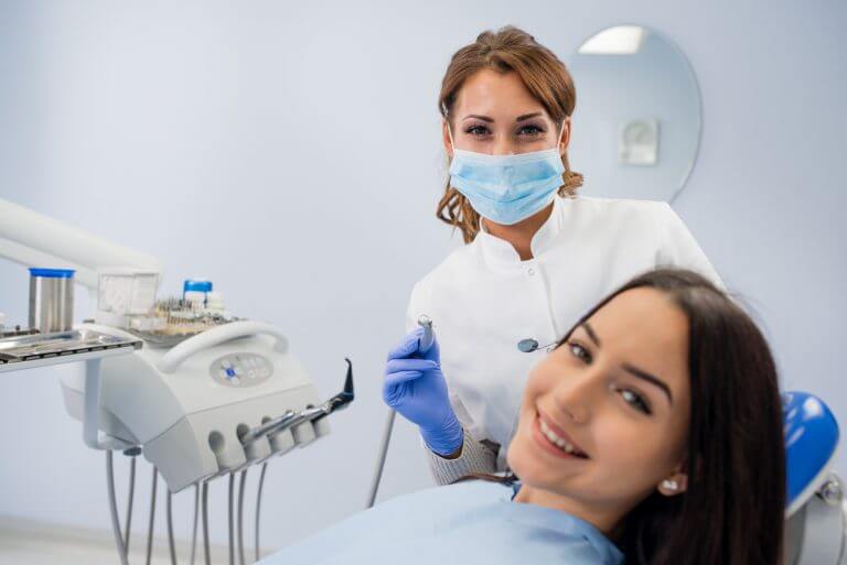 Stock image showing female patient and dentist