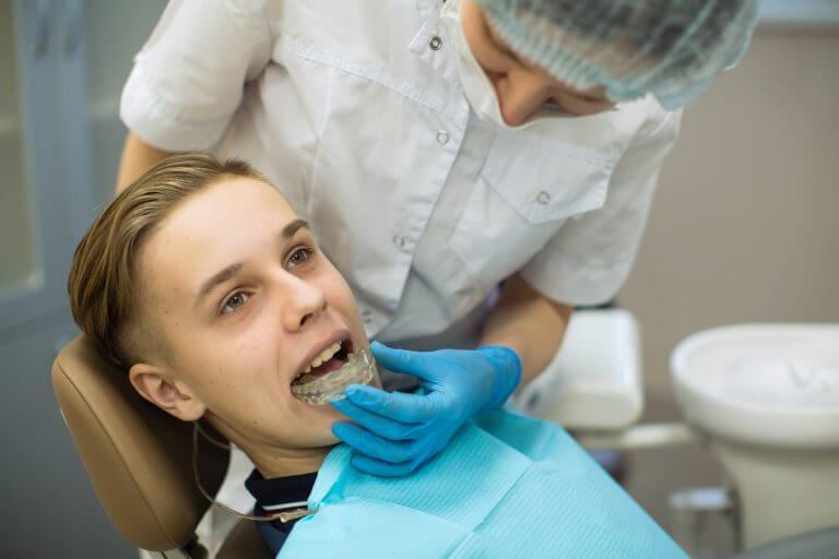 Stock image showing male patient and dentist