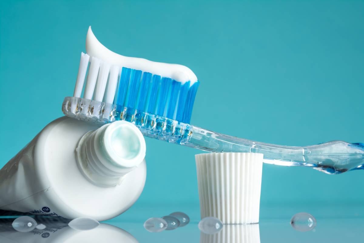 Toothpaste with fluoride to fight cavities on a toothbrush.