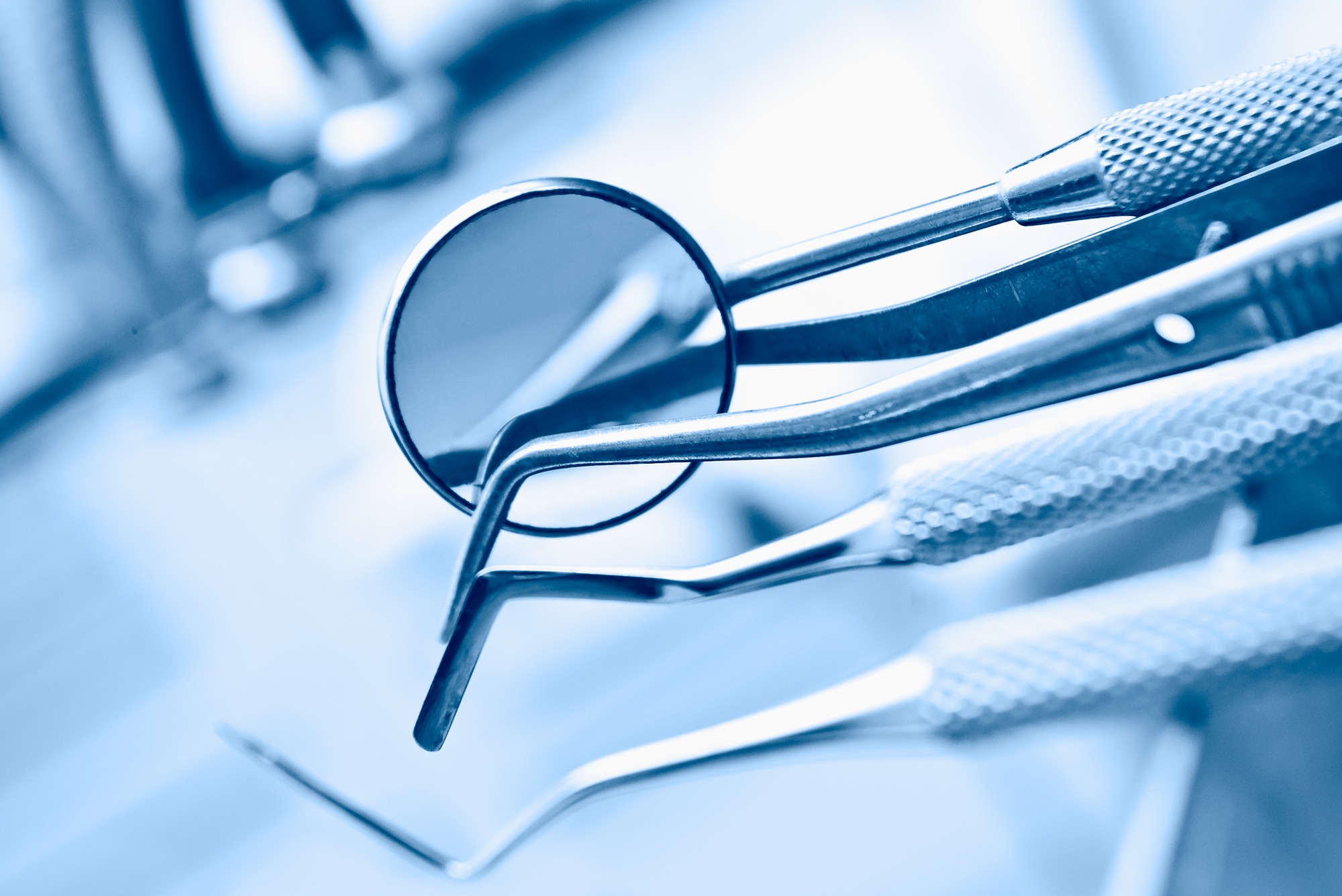 dentist-Beverly-Hills-CA - dentist's instruments with shallow depth of field blue tinted