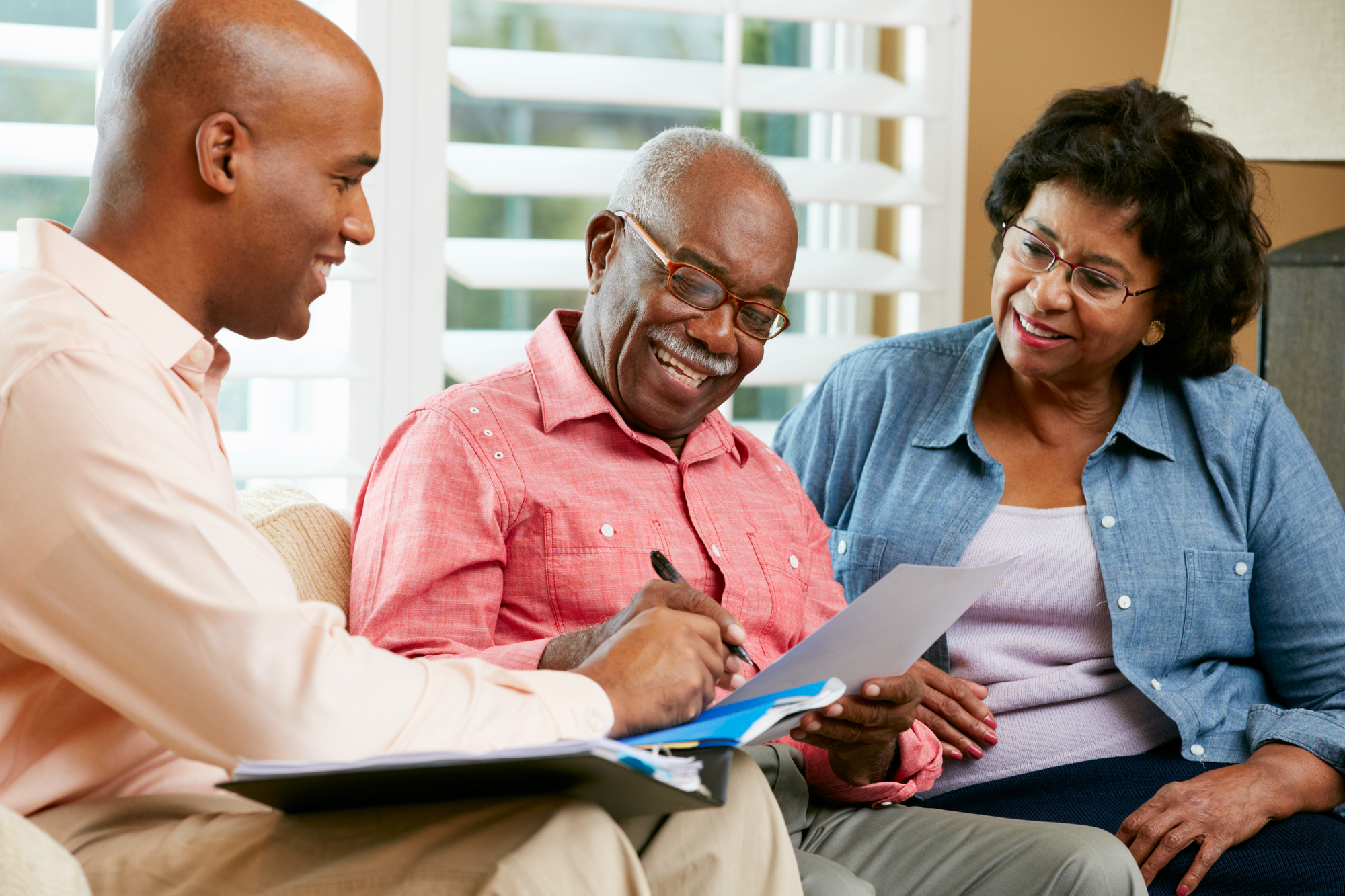 When Is It Time to Update Your Will? - Financial Advisor Talking To Senior Couple At Home